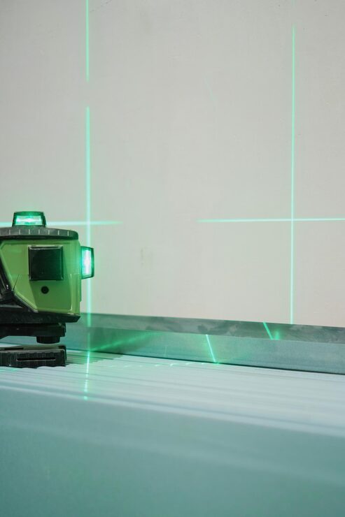 laser-measuring-level-construction-work-shallow-depth-field-construction-laser-level-work-construction-finishing-works_166373-1897